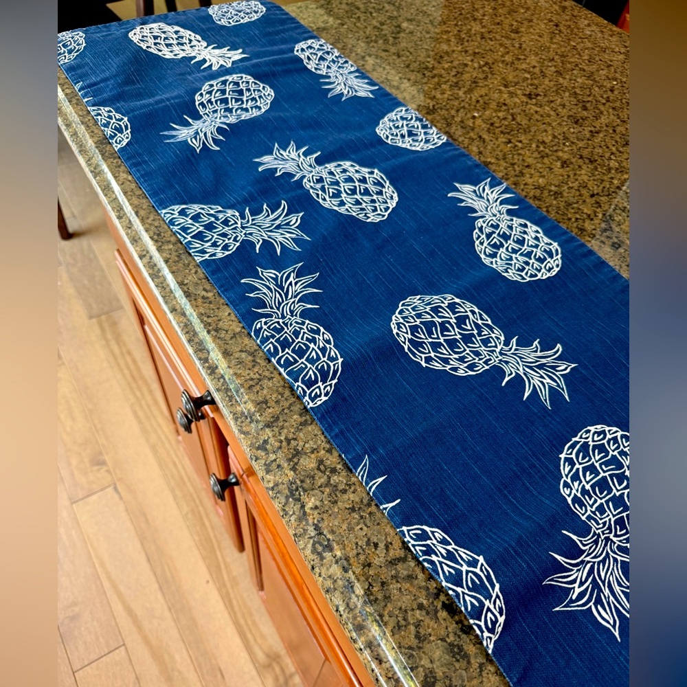 Table runner, blue and white graphics. Excellent condition.